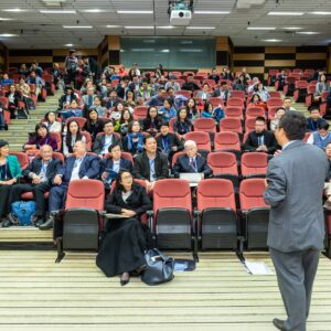 man standing in front of people